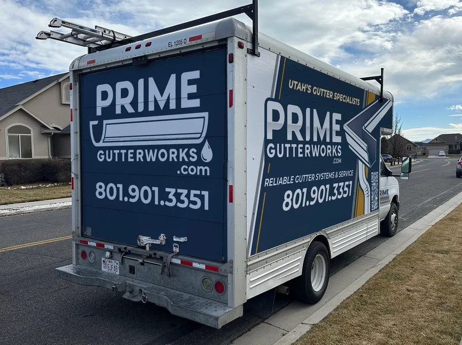 Rear and side view of a Prime Gutterworks service truck